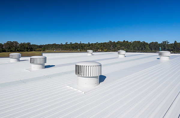 Matching wind-powered Hurricane ventilators on roof